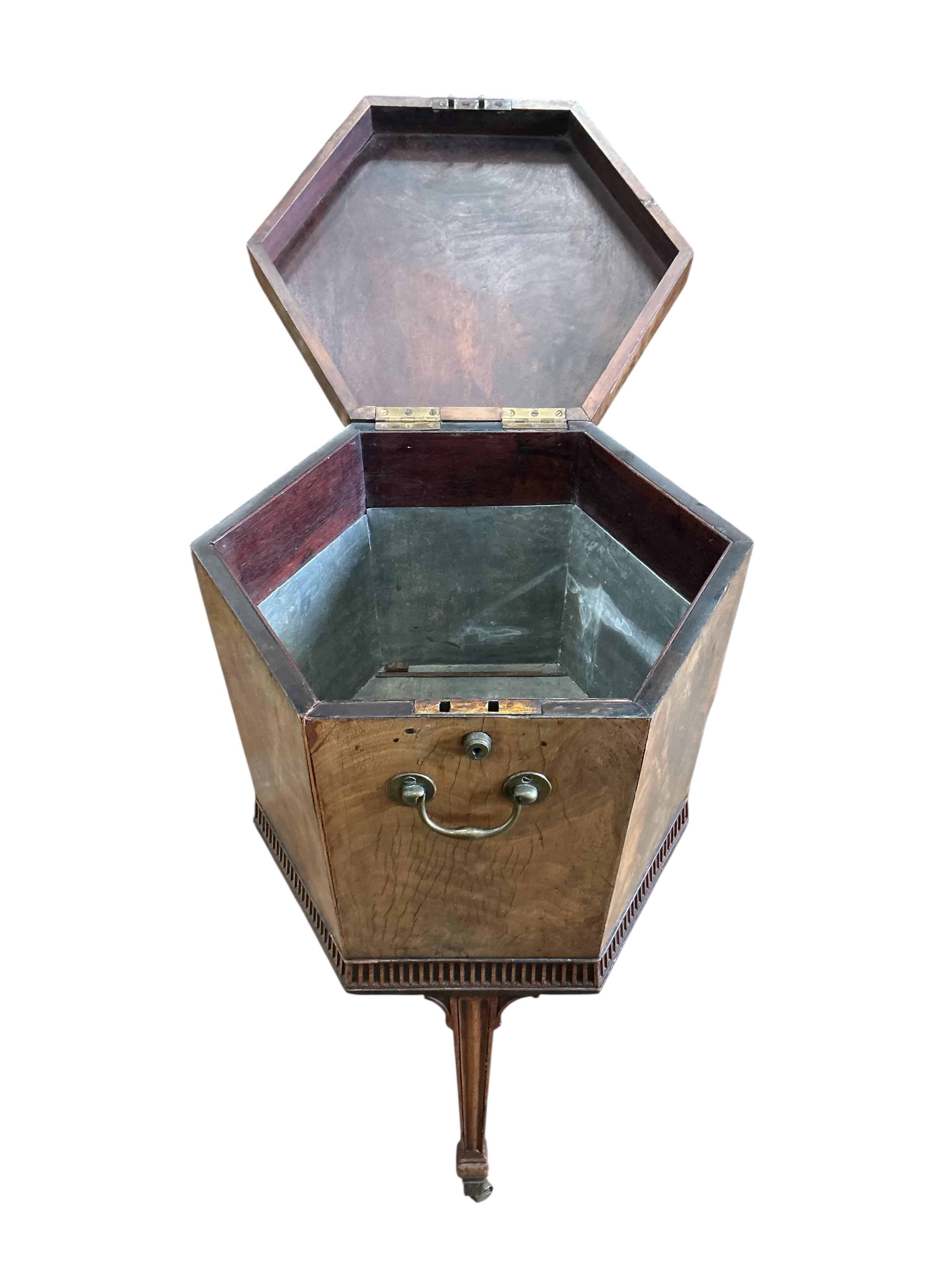 A George III inlaid mahogany hexagonal cellarette, width 47cm, height 75cm